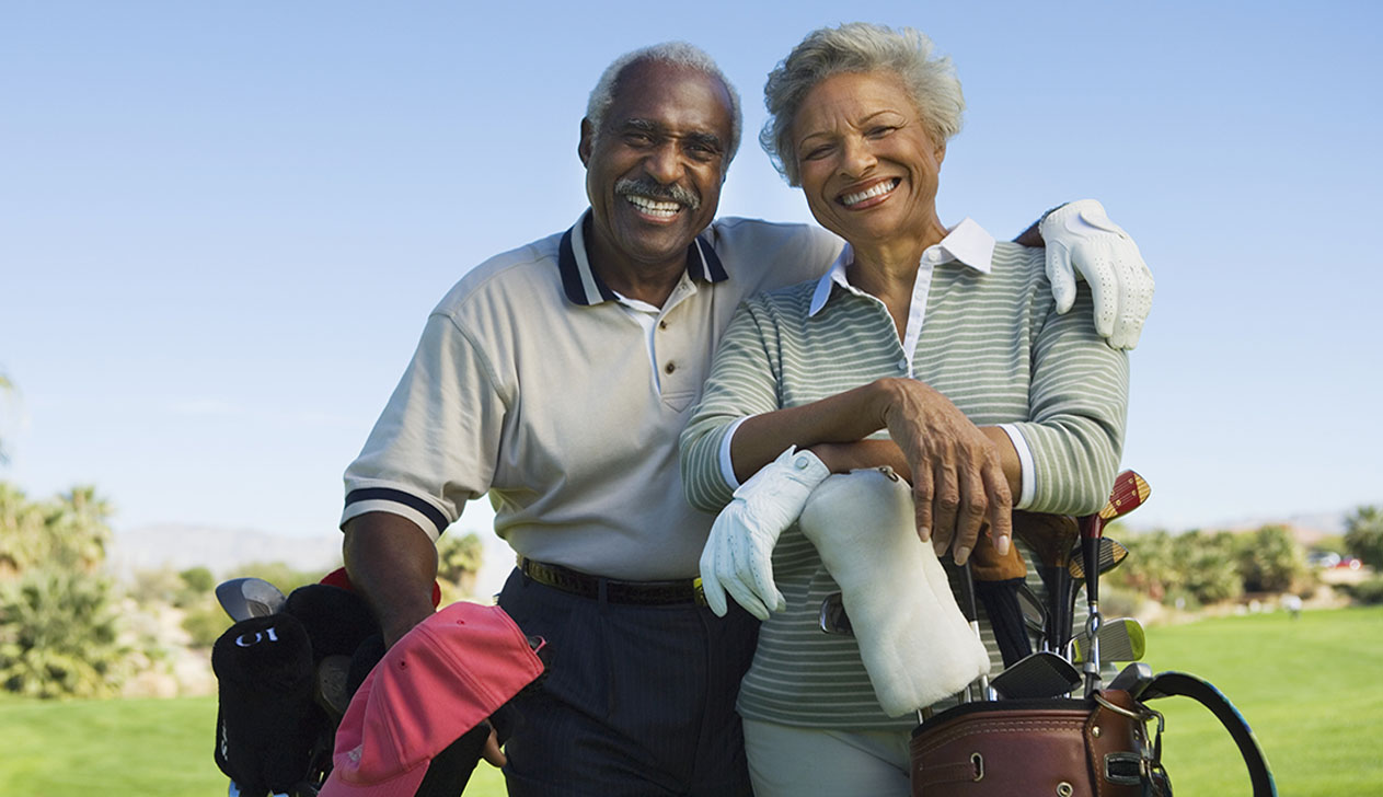 Photo of a Couple Playing Golf